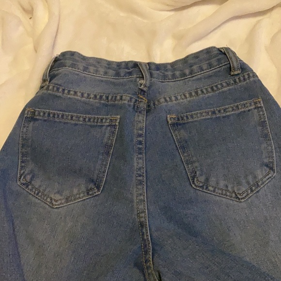 Blue jeans with rips down the side - Picture 4 of 4